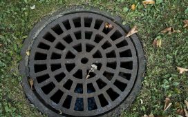 How To Disguise Raised Drain Covers In Garden